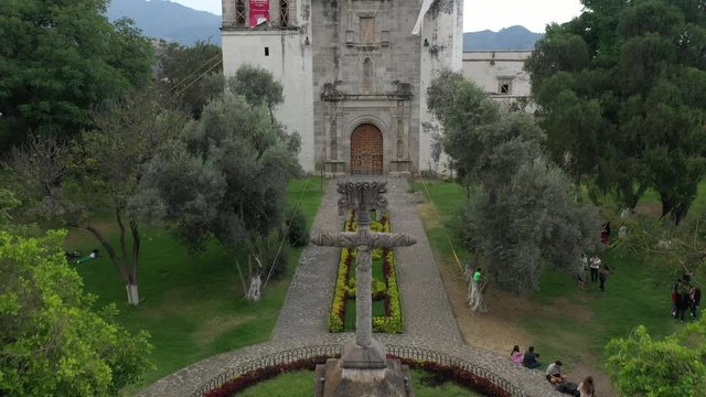 Aerial drone video of the stone cross and the colonial Transfiguration Agustinian Convent in Malinalco, Mexico, after the earthquake