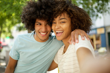 Close up happy african american young couple smiling together