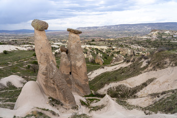 Three Graces are the brilliant three fairy chimneys fungous This amazing natural formation of sandstone located on Urgup Cappadocia Province in the Central Anatolia Region of Turkey, Asia.