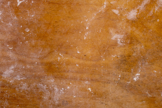 Old cutting board sprinkled with flour. Tools for cooking. Wood background.
