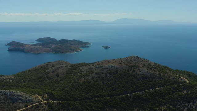 Aerial bird's eye view video taken by drone of bay and iconic Monastery of Panormitis, Symi island, Dodecanese, Greece