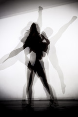 modern ballet dancers performing together. double exposure photo