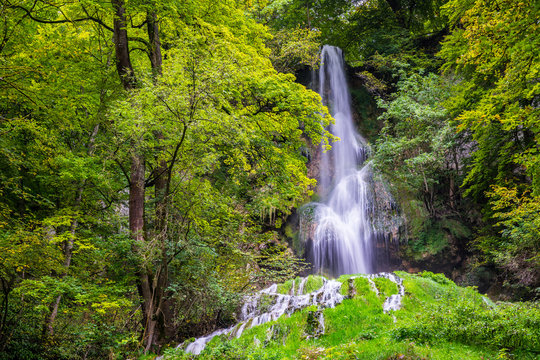 Germany, Famous 37m tall waterfall in bad urach in swabian jura nature landscape of climatic spa region in green forest