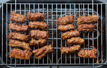 Grilled meat on the grid - from above - garden party scene