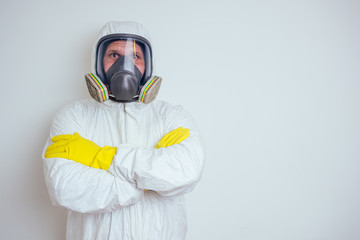 pest control worker spraying pesticides with sprayer in apartment copy spase white walls background