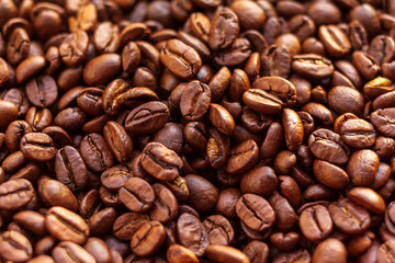 Roasted aromatic brown coffee beans background