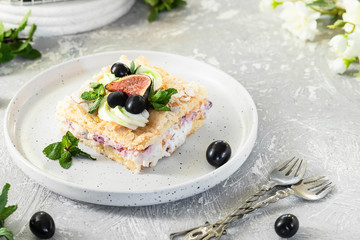 Pavlova on a biscuit with a gentle curd cream and fruit.