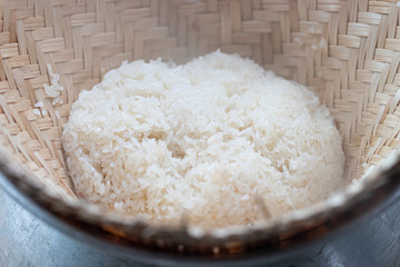 Steaming sticky rice on earthen steamer, Northeastern of thailand food