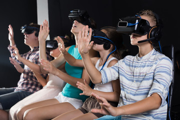 Family  watching video in  room of virtual reality
