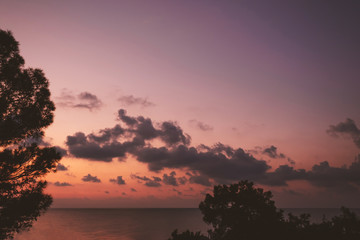 Beautiful pink sunrise over river. Bright landscape with rising sun and clouds. Panoramic seascape at dawn. Peaceful twilight scenery. Early morning. Tranquil evening scenery. Nature wallpaper