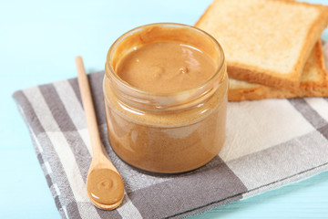 creamy peanut butter on the table. Peanut paste.