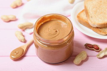 Obraz na płótnie Canvas creamy peanut butter on the table. Peanut paste.