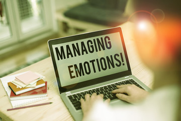 Text sign showing Managing Emotions. Business photo showcasing ability be open to feelings and modulate them in oneself woman laptop computer office supplies technological devices inside home