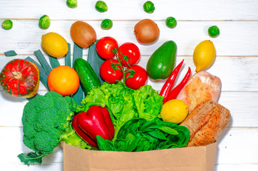 An eco-friendly paper bag with fresh food for a healthy diet.