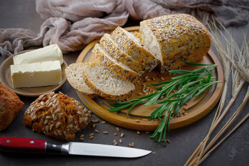 Bread in a composition with kitchen accessories on an old background