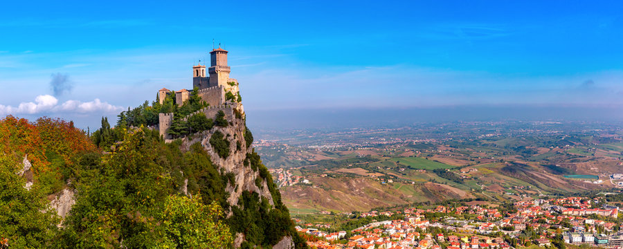 Panorama of First tower Guaita fortress in the city of San Marino of the Republic of San Marino and italian hills in sunny day