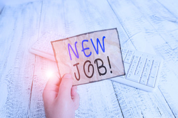 Conceptual hand writing showing New Job. Concept meaning recently having paid position of regular employment Man holding colorful reminder square shaped paper wood floor