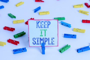 Word writing text Keep It Simple. Business photo showcasing to make something easy to understand and not in fancy way Colored clothespin papers empty reminder white floor background office