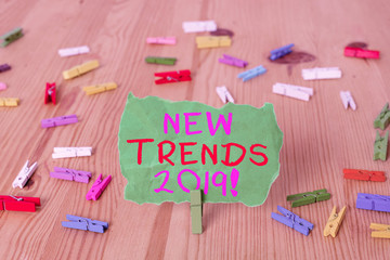 Word writing text New Trends 2019. Business photo showcasing general direction in which something is developing Colored clothespin papers empty reminder wooden floor background office