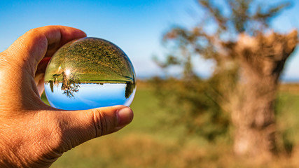 Crystal ball landscape shot near Wallersdorf, Bavaria, Germany