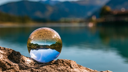 Crystal ball alpine landscape shot at the famous Pillersee, Tyrol, Austria