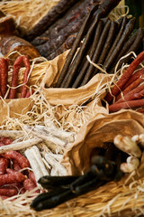 many different varieties of uncooked dried sausages