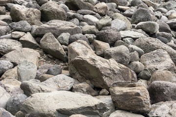 Fototapeta na wymiar Rocks texture at Jeongbang waterfall in Jeju Island, South Korea