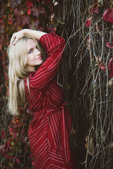 young beautiful pregnant woman in a red dress
