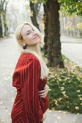 young beautiful pregnant woman in a red dress