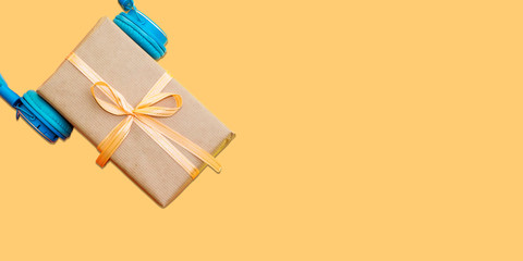 Christmas music gift concept. Headphones and gift boxes on colorful background