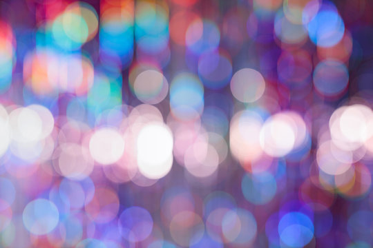 Abstract colorful background with bokeh defocused lights.