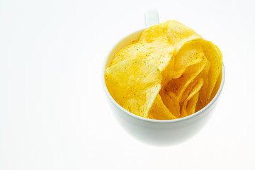 Potato chips in white cup  isolated on white background