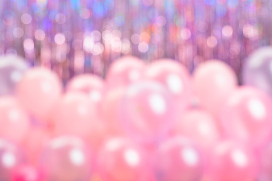 Defocused Pink And Purple Balloons On Colorful Background.