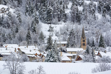 Village of La-Salle-les-Alpes with fresh snow in winter. Serre Chevalier Valley, Hautes-Alpes (05), Alps, France
