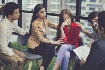 Fototapeta premium Group problematic young people talking with a guidance counselor.