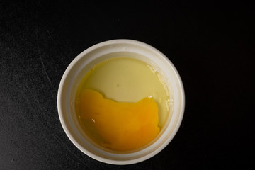 Raw eggs in a bowl to be added to a recipe