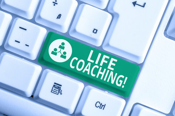 Writing note showing Life Coaching. Business concept for demonstrating employed to help showing attain their goals in career White pc keyboard with note paper above the white background