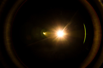 abstract lens flare red light over black background