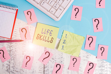 Text sign showing Life Skills. Business photo text skill that is necessary for full participation in everyday life Writing tools, computer stuff and math book sheet on top of wooden table