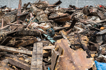 Pile or stack of old and dirty scraps of wood garbage.
