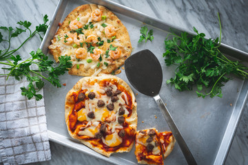 Flatbread pizzas with shrimp and sausage