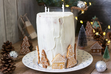 Homemade honey cake with sour cream, decorated with gingerbread. Rustic style.