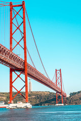 Red bridge, Lisbon, Portugal. Ponte 25 de Abril Suspension Bridge over the Tagus river.