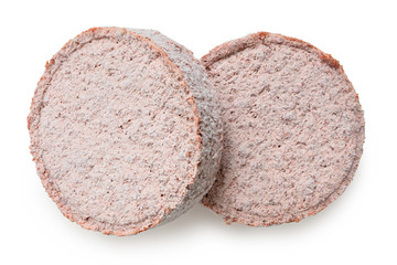 Two frozen plant based burger patties isolated on white. Top view.
