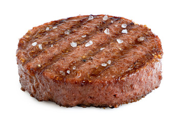 Plant based grilled burger patty with grill marks and rock salt isolated on white.
