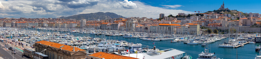 Fototapeta na wymiar Marseilles. Panoramic view of the old port and the city embankment.