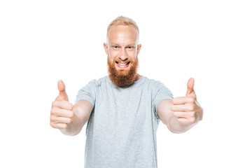 handsome smiling man in grey t-shirt showing thumbs up, isolated on white