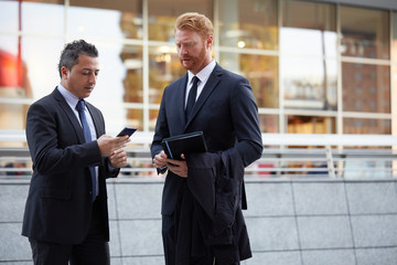 Fototapeta premium business people working outside office building