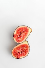 cut into two halves figs on a white background, top view