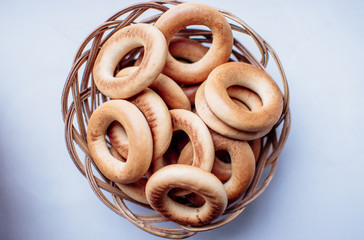 bagels in a wicker basket on a white background, isolate. Tea Party Concept